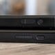 The power and volume buttons on the new Switch OLED (bottom) are slightly longer than those on the original Switch (top).